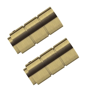 May include: Two gold-toned metal decorative objects with a brushed finish. Each object is rectangular with a series of stepped segments. The objects are angled against a white background.