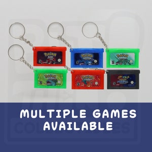 May include: Six different Game Boy Advance game cartridges on keychains. The cartridges are red, blue, green, black, and two different shades of green. The games are Pokemon Ruby Version, Pokemon Sapphire Version, Pokemon Emerald Version, Pokemon FireRed Version, Pokemon LeafGreen Version, and Pokemon Pinball: Ruby & Sapphire.  Multiple games available.