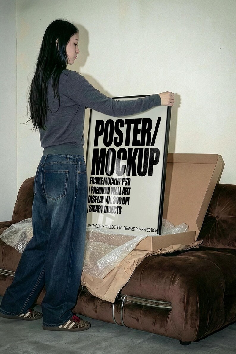 Frame Mockup PSD  – Premium Wall Art Display | 4K, 300 DPI, Smart Objects, Unboxing Poster Mockup with person. Framed Poster Video Mockup • Unboxing Frame on Iconic 70s  Sofa • Realistic Wall Art Presentation • Minimal Interior Lifestyle Mockup • PSD Mockup