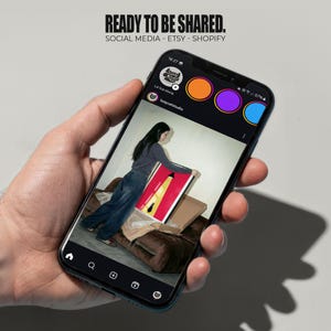 May include: A smartphone displays an Instagram post featuring a person holding a framed artwork with red, yellow, and black elements. The phone screen shows the text "READY TO BE SHARED." The Instagram story highlights the Etsy and Shopify platforms.