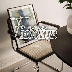 May include: A rectangular picture frame with a black border resting on a chair with a cane seat and chrome frame. The frame displays an abstract graphic with blue and yellow tones. Text on the image reads Frame MOCKUP. 4K RESOLUTION PSD.