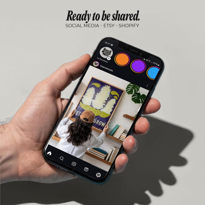 May include: A smartphone displays a social media post with the text "Ready to be shared." The post features a painting with the words "Let Grow" and a person adjusting the artwork. The phone's interface includes social media icons.