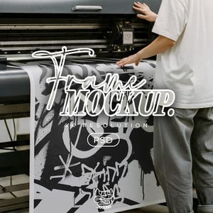 May include: A large format printer producing a black and white art print. The print features graffiti-style artwork with the words "Frame Mockup" in a stylized font. The image also includes the text "4K Resolution" and "PSD".
