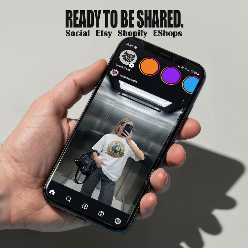 Oversized white t-shirt mockup featuring a trendy woman taking a mirror selfie in an elevator, ideal for streetwear brands. tshirt mock up for e-commerce and social media posts.