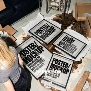 May include: Four rectangular framed posters displayed on a cowhide rug. Each poster features the bold black text POSTER/MOCKUP, along with smaller text including FRAME MOCKUP PSD, PREMIUM WALL ART, DISPLAY 4K, 300 DPI, and SMART OBJECTS.