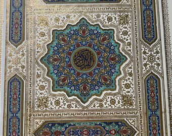 May include: A decorative book cover with an ornate design. The cover features a white background with gold, blue, red, and teal accents. The central design is a teal and blue starburst with Arabic calligraphy. The border is gold with intricate patterns.