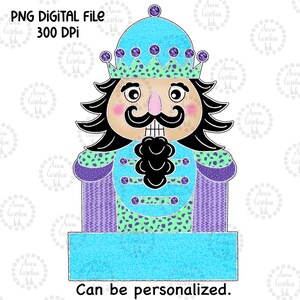 May include: A blue and purple nutcracker with a crown and a blank sign that says "Can be personalized."