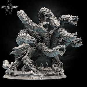 May include: A gray, detailed, multi-headed hydra sculpture with a textured surface. The hydra is posed in a dynamic stance with its heads raised and mouths open. The sculpture is set on a circular base with a textured surface.