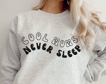 Sudadera de cuello redondo "Mamás nunca duermen" / Ropa de maternidad