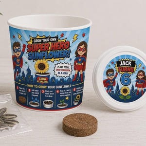 May include: A blue and white grow your own sunflower kit featuring superhero illustrations and the text Grow Your Own Super Hero Sunflower. The lid displays Jack Turns 6 with superhero characters. Includes a plastic cup, a coir disc, and seeds.