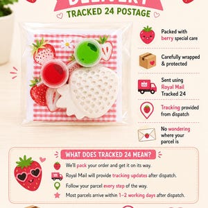 May include: A clear plastic package containing a white strawberry-shaped object and two small circular containers with red and green contents, set against a red and white checkered background with text reading BERRY FAST DELIVERY.