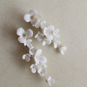 delicate white porcelain flowers and blossoms hairpin