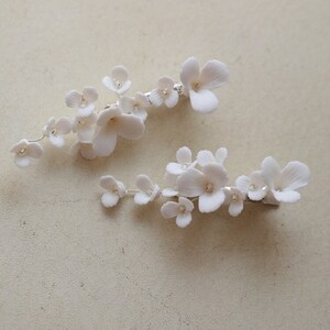 delicate white porcelain flowers and blossoms hairpin