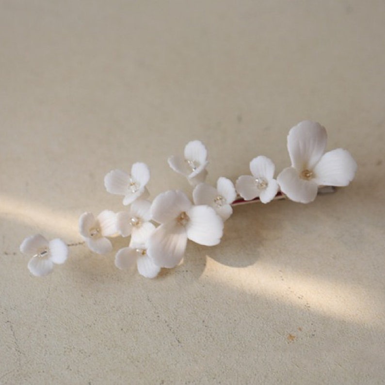 delicate white porcelain flowers and blossoms hairpin