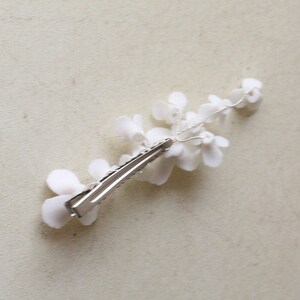 delicate white porcelain flowers and blossoms hairpin