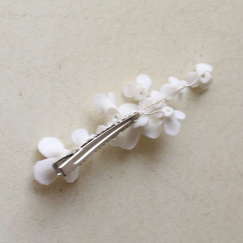 delicate white porcelain flowers and blossoms hairpin