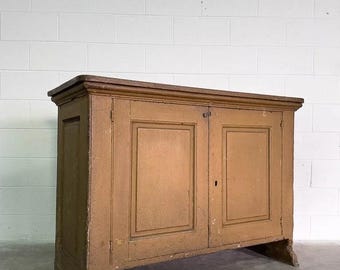 Antique cupboard with a shelved interior