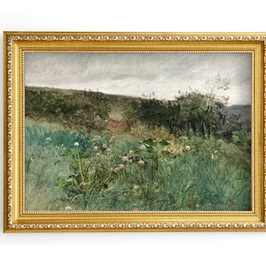 May include: A framed landscape painting with a gold ornate frame. The artwork depicts a field of tall green grass and wildflowers under a cloudy sky. The painting has a vintage aesthetic.