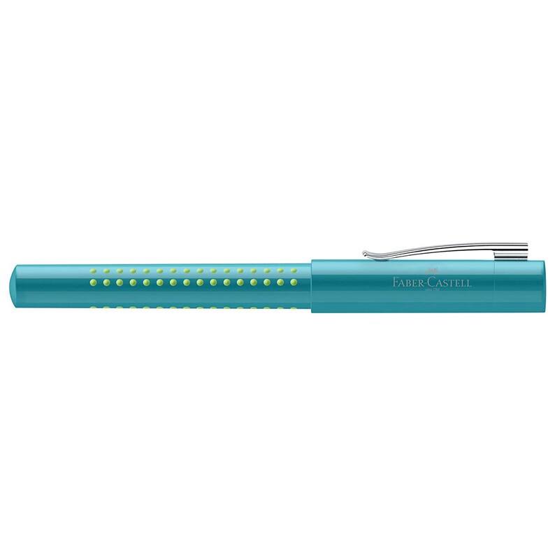 May include: A teal blue pen with a silver clip and a green dotted pattern. The pen has the text "FABER-CASTELL" printed on the side.