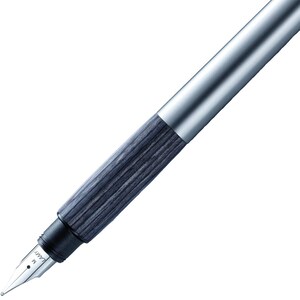 May include: A silver and grey fountain pen with a wood-grain pattern on the barrel. The pen has a metal nib with the word "LAMY" and the letter "M" engraved on it.
