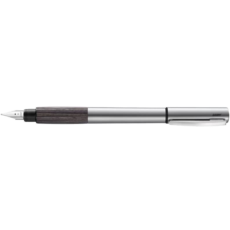 May include: A silver and wood fountain pen with the word "LAMY" printed on the side.