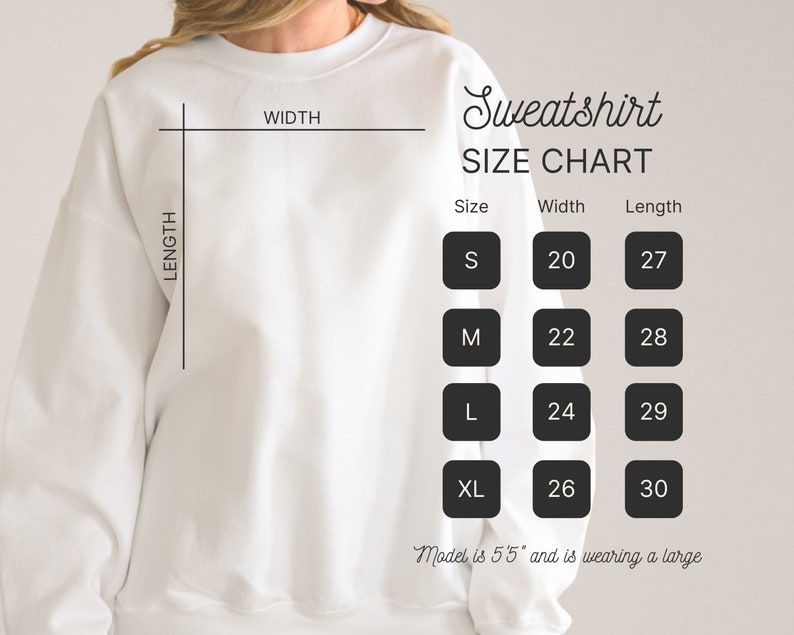 May include: A white sweatshirt with a size chart. The chart shows measurements for sizes S, M, L, and XL, with widths ranging from 20 to 26 inches and lengths from 27 to 30 inches. The text also states the model is 5'5" and wearing a large.