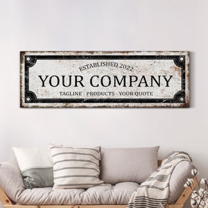 May include: A rustic, whitewashed sign with black lettering and a distressed woodgrain texture. The sign reads "Established 2022 Your Company Tagline - Products - Your Quote".