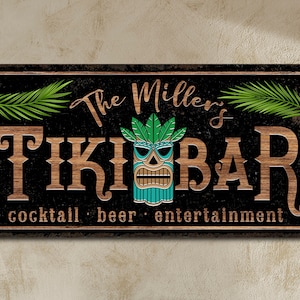 May include: A wooden sign with the text "The Miller's Tiki Bar" in brown letters on a black background. The sign also includes a tiki mask with green leaves and the text "cocktail - beer - entertainment".