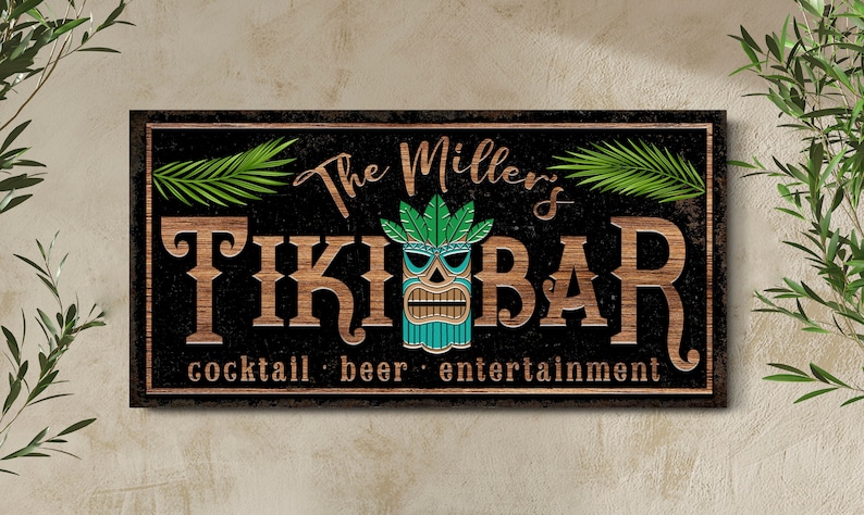 May include: A wooden sign with the text "The Miller's Tiki Bar" in brown letters on a black background. The sign also includes a tiki mask with green leaves and the text "cocktail - beer - entertainment".