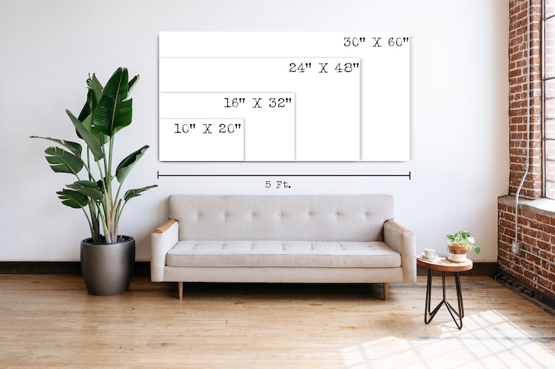 May include: A white wall with a sofa in front of it. The wall has four rectangular frames with different sizes and dimensions written on them. The dimensions are 30" x 60", 24" x 48", 16" x 32", and 10" x 20". The sofa is a light grey colour and has a wooden frame. There is a small table with a plant on it to the right of the sofa.