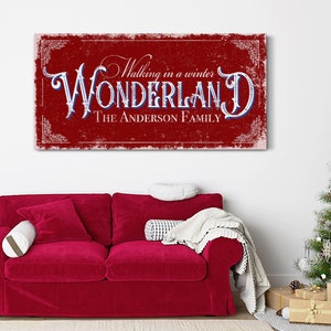 May include: Red and white canvas sign with the text "Walking in a winter WONDERLAND THE ANDERSON FAMILY" in a vintage style font.