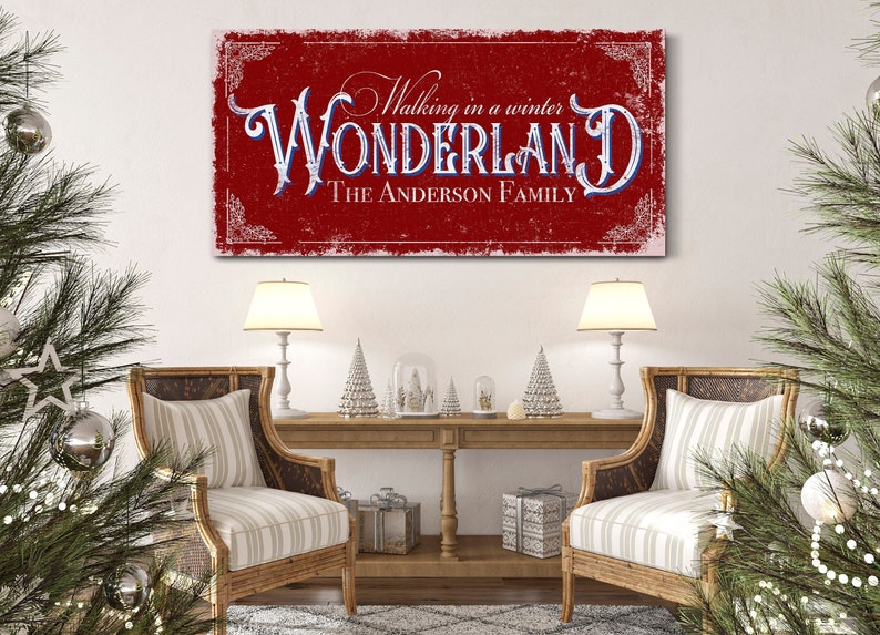 May include: Red and white canvas print with the text "Walking in a winter WONDERLAND The ANDERSON FAMILY" in a vintage style font.