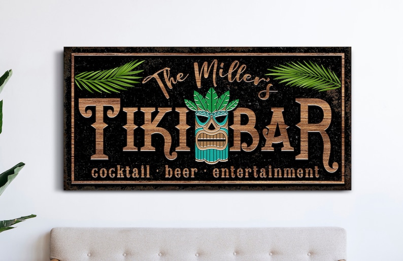 May include: A black and brown wooden sign with the text "The Miller's Tiki Bar" in white lettering. The sign also features a green and blue tiki mask and the text "cocktail, beer, entertainment".
