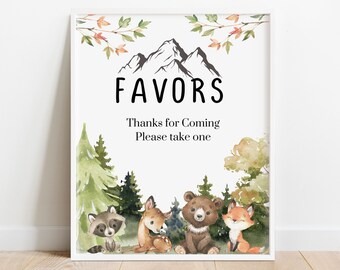 May include: A printable sign with a woodland theme. The sign says "Favors" and "Thanks for coming, please take one". The sign features a mountain range, trees, a raccoon, a deer, a bear, and a fox.