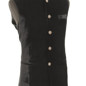 May include: A black velvet waistcoat with a mandarin collar and silver buttons.