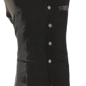 May include: A black velvet waistcoat with a mandarin collar and silver buttons.