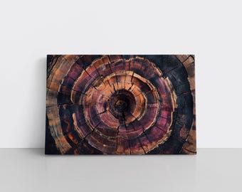 May include: A rectangular canvas print featuring a close-up of a tree stump's cross-section. The wood grain forms concentric circles in shades of brown, purple, and orange, creating a spiral pattern. The artwork is set against a white background.