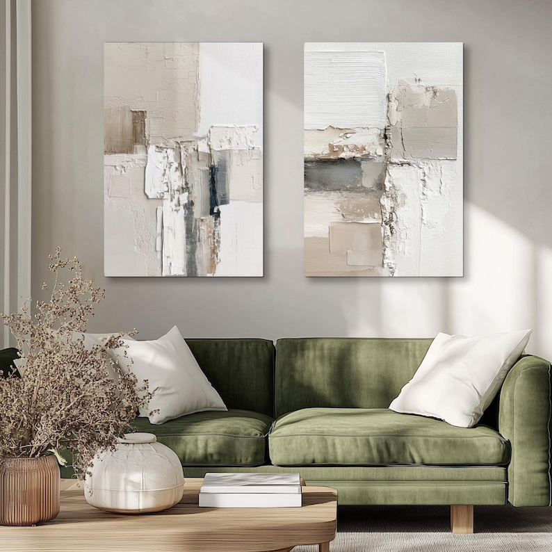 May include: Two vertical rectangular wall art pieces featuring abstract compositions with thick, layered impasto paint textures in neutral shades of white, cream, beige, taupe, and charcoal gray, displayed side by side on a plain wall.