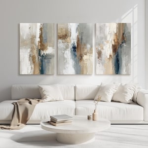 May include: A set of three vertical rectangular canvas paintings featuring abstract textured brushstrokes in shades of white, beige, light gray, dark brown, and navy blue, arranged side by side to create a cohesive multi-panel wall art display.