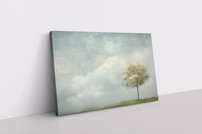 A calming lone tree amidst a blue sky with fluffy clouds, abstract painting on a framed and ready-to-hang canvas.