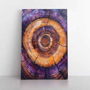 May include: A close-up of a tree trunk cross-section, showing the concentric rings of growth. The rings are a mix of purple, brown, and orange hues, creating a unique and abstract pattern.