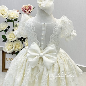 Adeline dress ivory button back. Lace baby girl dress. Ivory tailed baby girl dress. Long tail princess dress