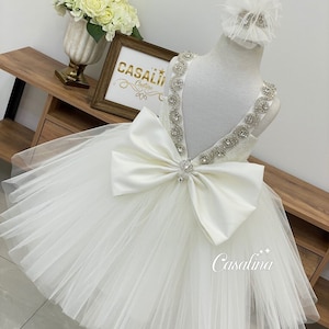 Monica Dress. White puffy big bow back V detail jewel embroidered baby girl dress, White flower girl dress. White knee length princess dress
