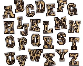 May include: A set of 26 iron-on patches featuring the alphabet in a leopard print design. Each letter is outlined in black and has a brown and gold leopard print pattern.