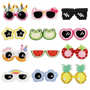 May include: Twelve embroidered iron-on patches featuring different sunglasses designs. The designs include a watermelon, a pineapple, a strawberry, a frog, a cloud, a flower, a star, a heart, a birthday cake, a Hello Kitty cat, and a pair of sunglasses with a checkered pattern.
