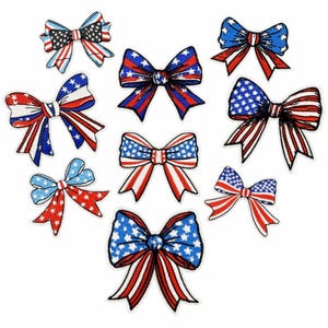 May include: A selection of bow appliques in patriotic colours. Each bow features red and white stripes, blue fields with white stars, and a white border. Ideal for crafting and adding a festive touch to projects.