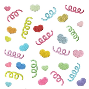 May include: Assortment of colorful felt heart and curly ribbon patches. The patches are in various colors, including pink, blue, green, yellow, and orange.