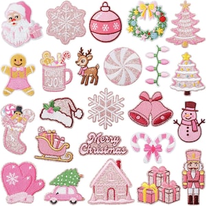 May include: A collection of twenty-five embroidered iron-on patches featuring Christmas themes in shades of pink, white, and green. Designs include Santa, snowflakes, ornaments, a wreath, trees, a gingerbread person, a mug, a reindeer, and gifts.