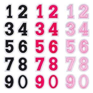 May include: Embroidered number patches in black, hot pink, and light pink. Each number is outlined in white. Numbers 1 to 0 are displayed in various styles, ideal for personalising clothing or accessories.