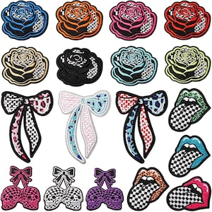 May include: A collection of embroidered patches featuring various designs including roses in multiple colors, bows with checkered and leopard patterns, lips with checkered tongues, and pairs of skulls topped with bows in pink, black, and purple.